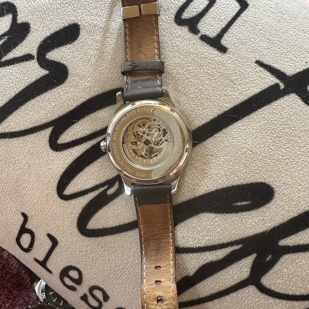 Kenneth Cole
Men's Brown and Silver Watch